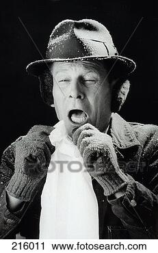 Stock Photography - snow-covered man 
sneezing in black 
and white. fotosearch 
- search stock 
photos, pictures, 
images, and photo 
clipart