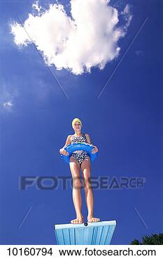 Stock Photo - swimmers on diving 
board inflatable 
ring. fotosearch 
- search stock 
photos, pictures, 
images, and photo 
clipart