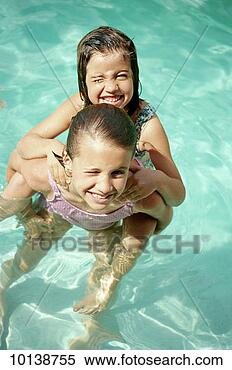 Stock Image - two young sisters 
in water, st john, 
us virgin islands. 
fotosearch - search 
stock photos, 
pictures, images, 
and photo clipart