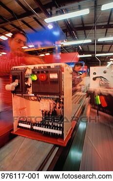 Stock Photography - workers on low 
voltage motor 
control assembly 
line. fotosearch 
- search stock 
photos, pictures, 
images, and photo 
clipart
