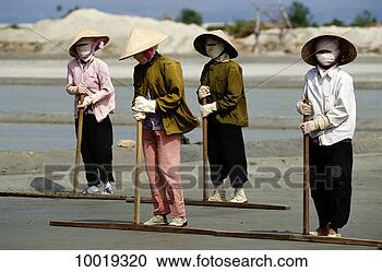 Stock Photography - workers in the 
salt fields in 
nha trang, vietnam. 
fotosearch - search 
stock photos, 
pictures, images, 
and photo clipart