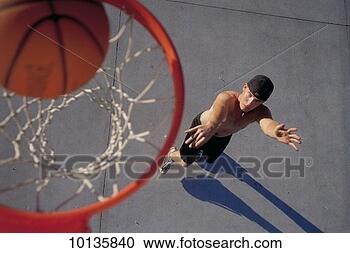 Stock Photography - young man shooting 
hoops, basketball. 
fotosearch - search 
stock photos, 
pictures, images, 
and photo clipart