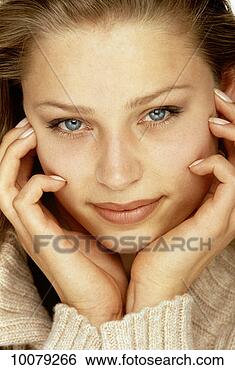 Stock Photo - young woman with 
hands on face. 
fotosearch - search 
stock photos, 
pictures, images, 
and photo clipart