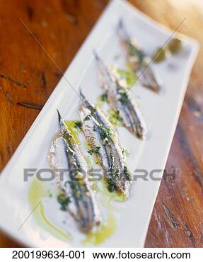 Stock Photography - sardines marinated 
in garlic, olive 
oil and salt on 
serving tray. 
fotosearch - search 
stock photos, 
pictures, images, 
and photo clipart