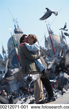 Stock Photography - couple embracing 
outdoors, venice, 
italy. fotosearch 
- search stock 
photos, pictures, 
images, and photo 
clipart