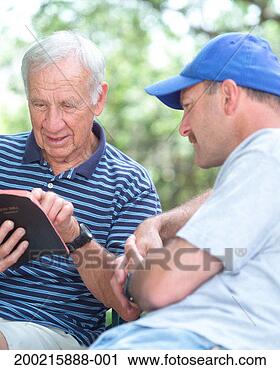 Stock Photography - two men reading 
bible. fotosearch 
- search stock 
photos, pictures, 
images, and photo 
clipart
