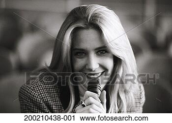Stock Photography - woman holding 
mike, close up. 
fotosearch - search 
stock photos, 
pictures, images, 
and photo clipart
