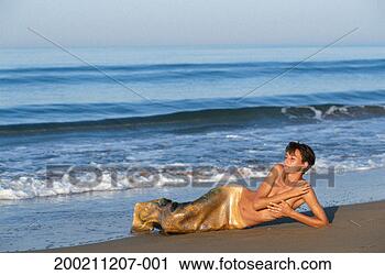 Stock Photography - woman in mermaid 
costume posing 
at beach. fotosearch 
- search stock 
photos, pictures, 
images, and photo 
clipart