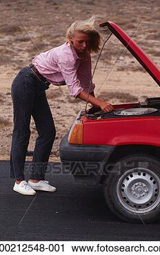Stock Photography - woman repairing 
car. fotosearch 
- search stock 
photos, pictures, 
images, and photo 
clipart
