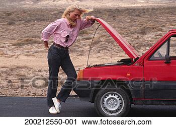 Stock Photography - woman watching 
car engine. fotosearch 
- search stock 
photos, pictures, 
images, and photo 
clipart