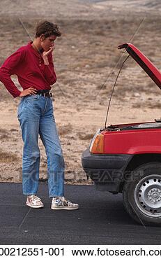 Stock Photography - woman watching 
car engine. fotosearch 
- search stock 
photos, pictures, 
images, and photo 
clipart