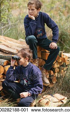 Stock Photography - boys (8-11) with 
binoculars on 
logs. fotosearch 
- search stock 
photos, pictures, 
images, and photo 
clipart