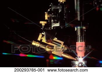 Stock Photography - refraction of 
lights, laser 
diamond cutter. 
fotosearch - search 
stock photos, 
pictures, images, 
and photo clipart