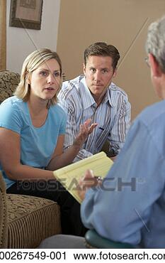 Stock Photography - couple talking 
to counselor at 
home. fotosearch 
- search stock 
photos, pictures, 
images, and photo 
clipart
