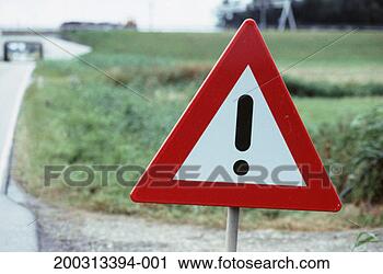 Stock Photography - hazard warning 
sign by country 
roadside, close-up. 
fotosearch - search 
stock photos, 
pictures, images, 
and photo clipart