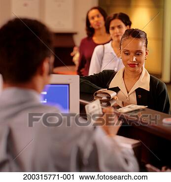 Stock Photography - woman withdrawing 
money at bank. 
fotosearch - search 
stock photos, 
pictures, images, 
and photo clipart