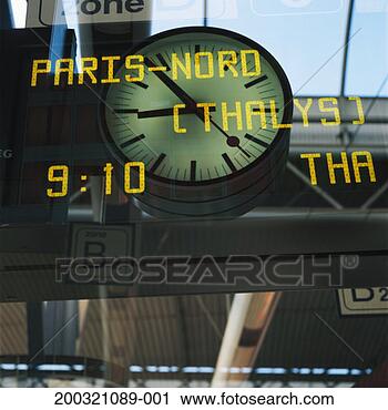 Stock Photography - view of clock 
through arrival 
departure board, 
low angle view. 
fotosearch - search 
stock photos, 
pictures, images, 
and photo clipart