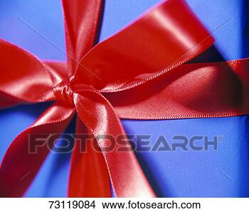 Stock Photo - red ribbon on 
gift, close-up. 
fotosearch - search 
stock photos, 
pictures, images, 
and photo clipart