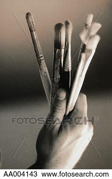 Stock Photo - close-up of an 
artist holding 
paintbrushes. 
fotosearch - search 
stock photos, 
pictures, images, 
and photo clipart