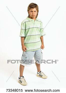 Stock Image - boy (10-11) standing 
with legs apart, 
portrait. fotosearch 
- search stock 
photos, pictures, 
images, and photo 
clipart