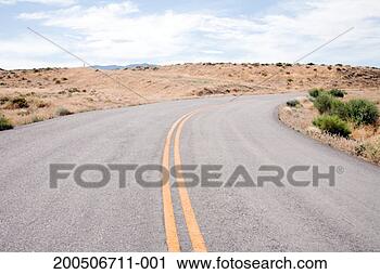 Stock Photography - curved road through 
desert. fotosearch 
- search stock 
photos, pictures, 
images, and photo 
clipart