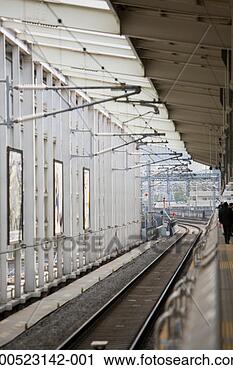 Stock Photography - deserted train 
track at station. 
fotosearch - search 
stock photos, 
pictures, images, 
and photo clipart