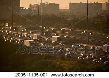 Stock Photography - heavy traffic 
on highway, sunrise. 
fotosearch - search 
stock photos, 
pictures, images, 
and photo clipart