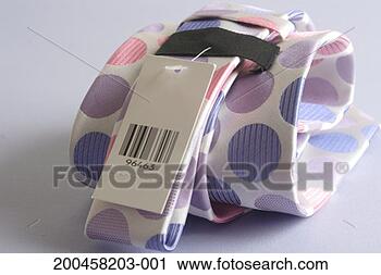 Stock Photography - spotted-pattern 
tie with barcoded 
tag attached, 
close-up. fotosearch 
- search stock 
photos, pictures, 
images, and photo 
clipart