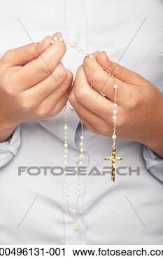 Stock Photography - teenage girl (16-18) 
holding rosary, 
mid section, close-up 
of hands. fotosearch 
- search stock 
photos, pictures, 
images, and photo 
clipart