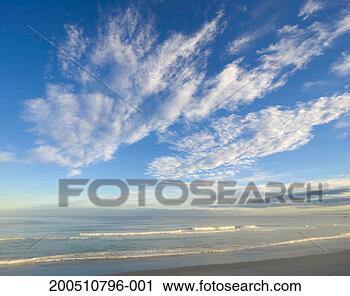 Stock Photography - waves breaking 
on beach, dusk. 
fotosearch - search 
stock photos, 
pictures, images, 
and photo clipart