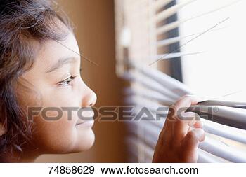 Stock Photograph - girl (4-5) looking 
out of window, 
smiling. fotosearch 
- search stock 
photos, pictures, 
images, and photo 
clipart