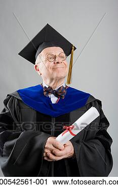 Stock Photography - senior man wearing 
academic regalia, 
holding diploma 
scroll, smiling. 
fotosearch - search 
stock photos, 
pictures, images, 
and photo clipart