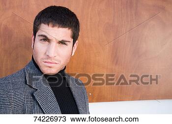 Stock Photo - 'young man pulling 
facial expression, 
portrait'. fotosearch 
- search stock 
photos, pictures, 
images, and photo 
clipart