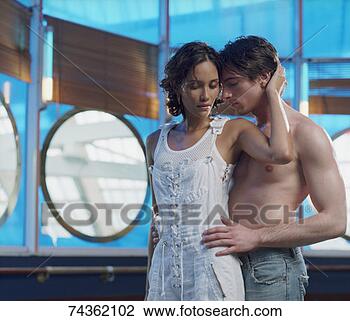 Stock Photo - young shirtless 
man embracing 
young woman in 
dress. fotosearch 
- search stock 
photos, pictures, 
images, and photo 
clipart