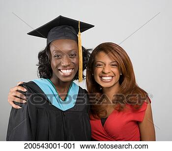 Stock Photography - young woman embracing 
young woman wearing 
academic regalia, 
portrait. fotosearch 
- search stock 
photos, pictures, 
images, and photo 
clipart