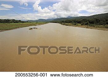 Stock Photography - costa rica, muddy 
river along pacific 
coast. fotosearch 
- search stock 
photos, pictures, 
images, and photo 
clipart