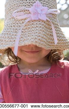 Stock Photography - girl (3-4) wearing 
hat over eyes, 
close-up, profile. 
fotosearch - search 
stock photos, 
pictures, images, 
and photo clipart