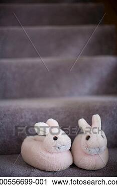 Stock Photography - pair of bunny 
slippers on staircase, 
close-up. fotosearch 
- search stock 
photos, pictures, 
images, and photo 
clipart