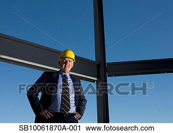 Stock Photography - senior business 
man at construction 
site, portrait. 
fotosearch - search 
stock photos, 
pictures, images, 
and photo clipart