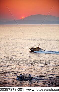 Stock Photography - greece, hydra, 
boats in bay, 
sunset. fotosearch 
- search stock 
photos, pictures, 
images, and photo 
clipart