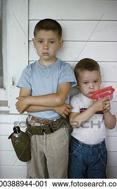 Stock Photography - two boys (3-7), 
portrait, one 
holding toy gun. 
fotosearch - search 
stock photos, 
pictures, images, 
and photo clipart