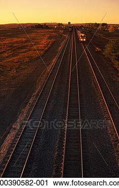 Stock Photography - usa, wyoming, 
train on tracks, 
dusk. fotosearch 
- search stock 
photos, pictures, 
images, and photo 
clipart