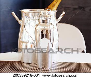 Stock Photography - cocktail shaker 
and champagne 
bucket on table, 
close-up. fotosearch 
- search stock 
photos, pictures, 
images, and photo 
clipart