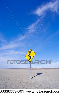 Stock Photography - curved arrow sign 
in dry lake bed. 
fotosearch - search 
stock photos, 
pictures, images, 
and photo clipart