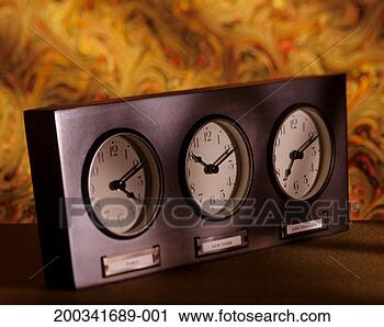Stock Photography - desk clock with 
three time zones 
for paris, new 
york and los angeles. 
fotosearch - search 
stock photos, 
pictures, images, 
and photo clipart