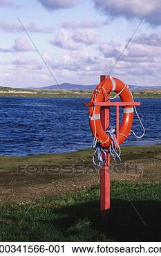 Stock Photography - life preserver 
on sea coast. 
fotosearch - search 
stock photos, 
pictures, images, 
and photo clipart