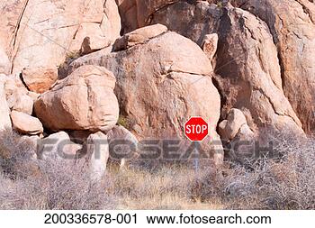 Stock Photography - stop sign in front 
of granite boulders. 
fotosearch - search 
stock photos, 
pictures, images, 
and photo clipart
