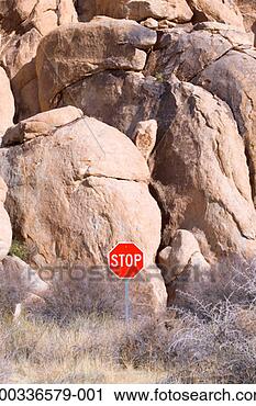 Stock Photography - stop sign in front 
of granite boulders. 
fotosearch - search 
stock photos, 
pictures, images, 
and photo clipart