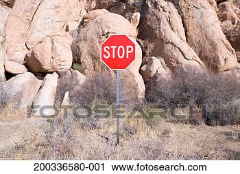 Stock Photography - stop sign in front 
of granite boulders. 
fotosearch - search 
stock photos, 
pictures, images, 
and photo clipart