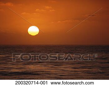 Stock Photography - sun low on horizon 
over pacific ocean, 
sunset. fotosearch 
- search stock 
photos, pictures, 
images, and photo 
clipart